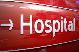 this image shows the word hospital in white on a red background.