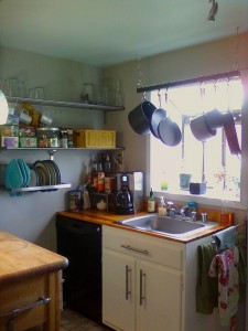 a cluttered but homely kitchen scene