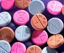 this image shows pills ,pink blue and brown. The are warfarin