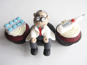 a CUPCAKE trio depicting a doctor meidication strip and thermometer
