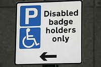 A sign showing disabled badge holders and a Parking P