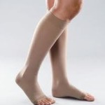 someone wearing a pair of toeless compression stockings