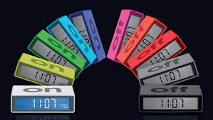 this image shows a selection of different coloured flip on/off alarm clocks