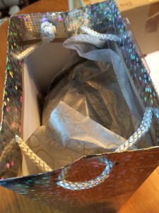this image shows a gift bag with tissue on the top