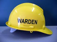 this image shows a yellow safety helmet and the word warden on it.