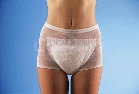 this image shows a young slim female wearing an inco pad with mesh pants