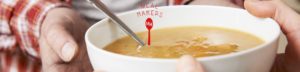 this image shows a bowl of soup and a meal makers logo