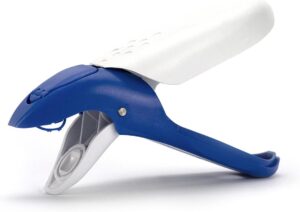 Image shows an applicator for Attach-a-tag clothing labels. It's called a dolphin as it resembles one in shape. It has a blue top and handle and a white underside and handle. It looks like a pair of secateurs. 
