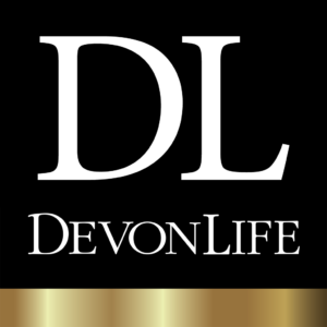 Work with me. This image shows the Devon Life magazine logo. It is a solid black square with a capital D and L in white at the top. Underneath is the word Devon Life in white.