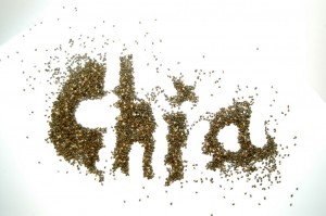 the word chia spelt in chia seeds on a white background