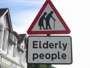 elderly road sign red triangle with an elderly man and woman inside