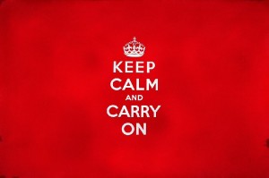 a red square with the words Keep calm and carry on in white writing
