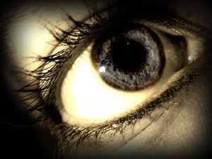 this image shows a single open eye with long eye-lashes