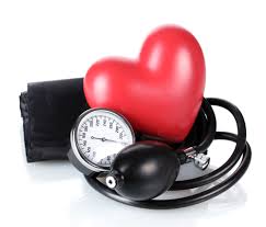 this image shows a red heart shape and an old fashioned doctors blood pressure cuff.