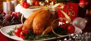 This image shows a whole turkey on a platter for Christmas