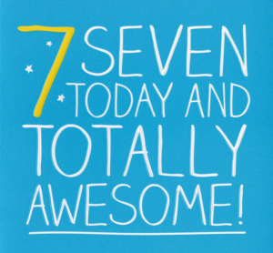 This image shows a blue background with a yellow number 7 on it and in white writing it says " Seven today and totally awesome