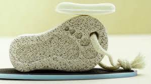 This image shows a pumice stone in the shape of a foot