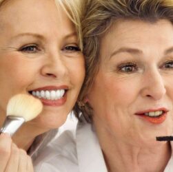 This image shows two ladies over 55 with make up brushes. One has blonde hair the other brown and for their ages they look pretty good!